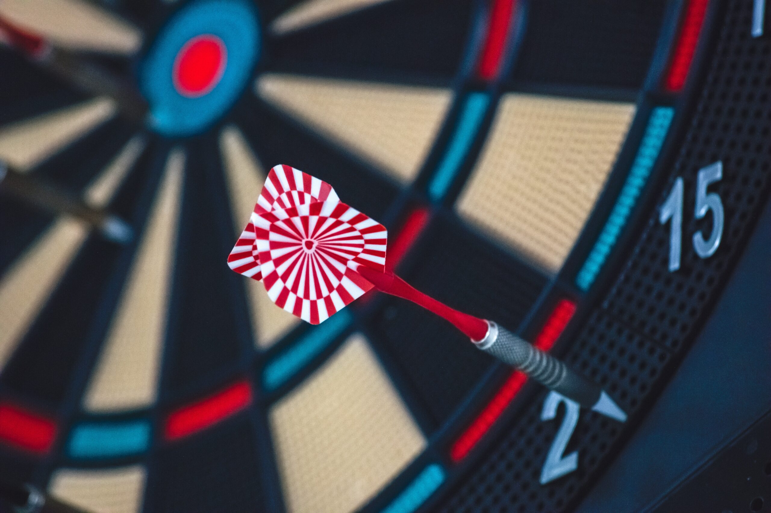 A dart landing in the centre of a target